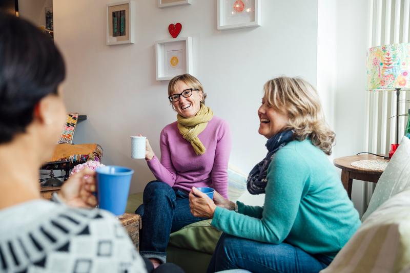 mature women sitting together with drinks