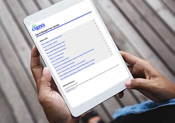 Image: Male hands holding tablet with FAQs on screen - Cigna.