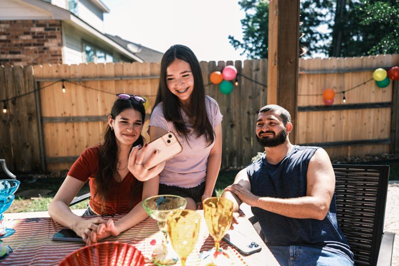 group of young Latinos at a backyard party