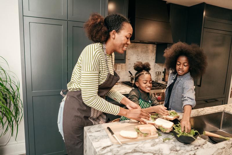 Family in the kitchen making sandwhices