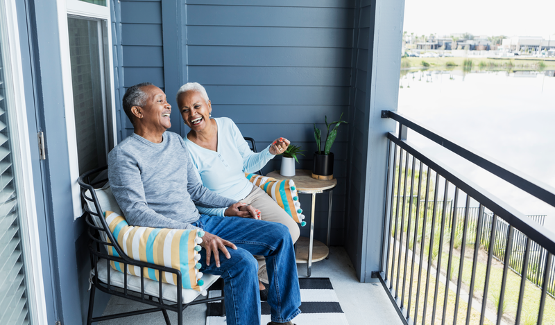 Older couple sitting on a balcony