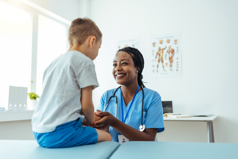 doctor examining child patient