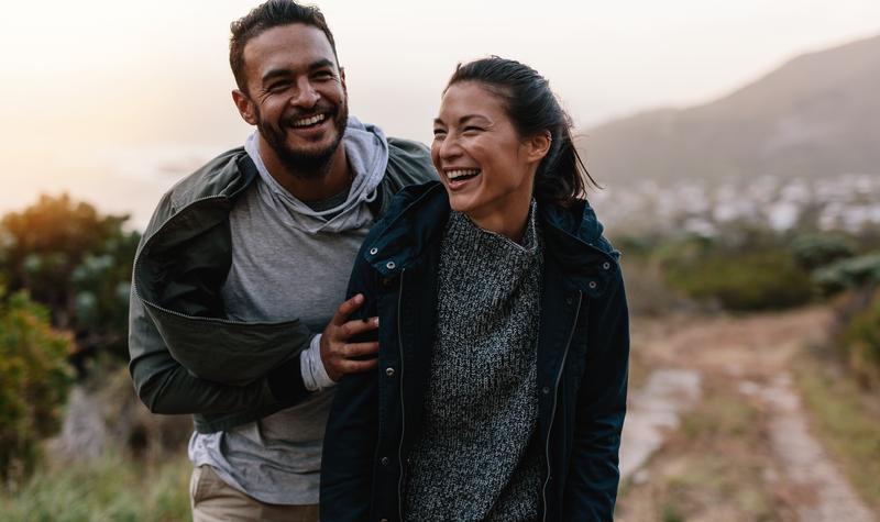 Man and woman hiking on a hill